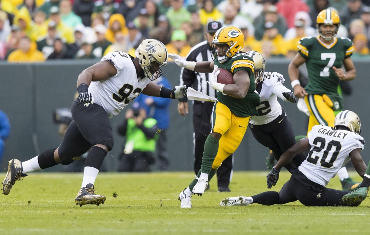 Green Bay Packers running back Aaron Jones (33) carries the ball against the New Orleans Saints. Mandatory Credit: Jeff Hanisch-USA TODAY Sports